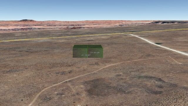 Desert landscape with digital coordinates overlay.