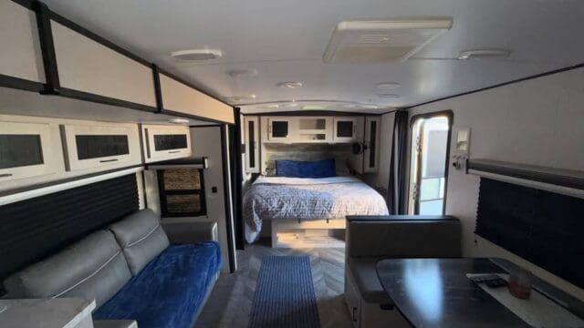 Interior of a modern RV with bed.